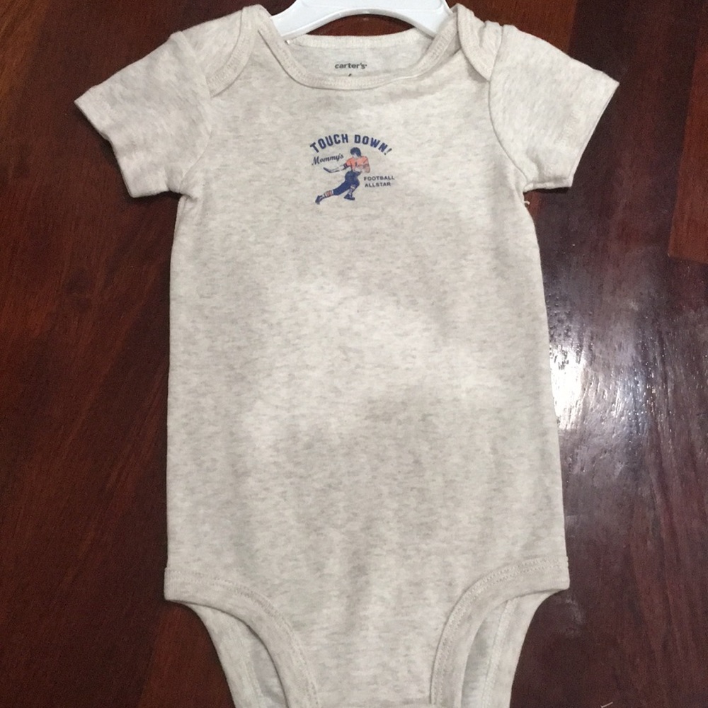 Brand new with a hole onesie 6mo Carter’s